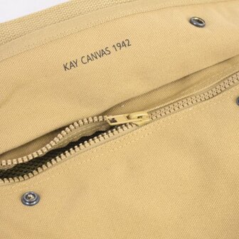 khaki canvas holdall with wrap-around carry straps and &ldquo;broad arrow&rdquo; marking.