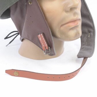 Detail of leather ear protectors and chin strap on WW2 Dispatch Rider helmet