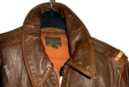 On a Original Leather 1st Lieutenant shoulder ranks for USAAF A-2 Flying Jacket