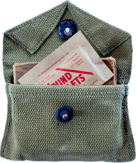 WW2 US Wound Tablets reproduction placed inside a green first aid pouch