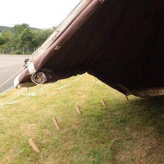 Side view of brown British WWII Bell Tent with traditional hemp guy ropes