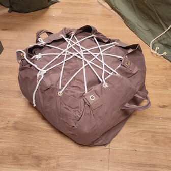 Side view of brown British WWII Bell Tent with traditional hemp guy carrie / cover bag