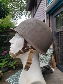 Left side view of original McCord M1 swivel bail helmet with Westinghouse liner