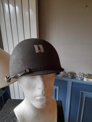 Reproduction US WWII M1 helmet with Captain Miller screen-accurate markings &ndash; front view