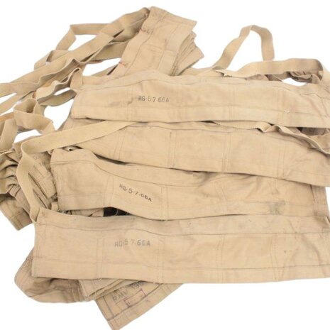 Stack of original British Army tan cotton bandoliers with date stamps and ammunition