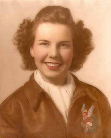 WASP Fifinella cloth chest patch with red background and winged mascot