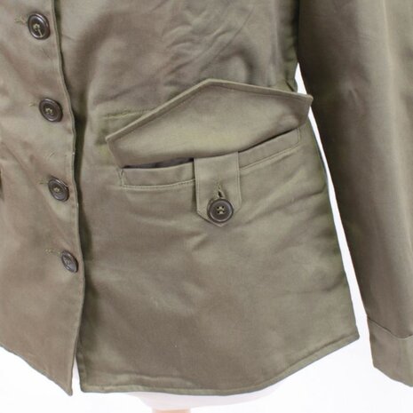 Detail of the button front and pockets on the US Women&rsquo;s M43 jacket