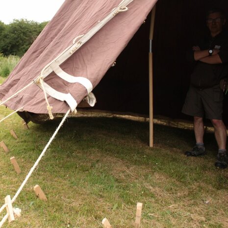 Side view of brown British WWII Bell Tent with traditional hemp guy ropes