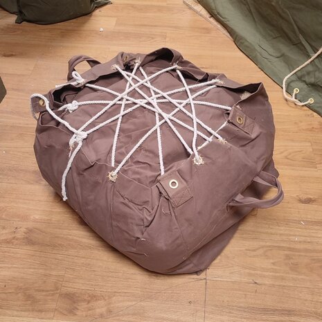 Side view of brown British WWII Bell Tent with traditional hemp guy carrie / cover bag