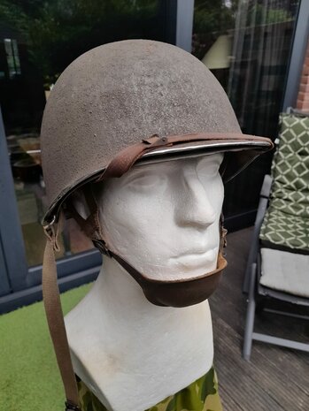 Original 1943 WWII US M1 McCord Airborne helmet with leather Normandy chin cup, front view