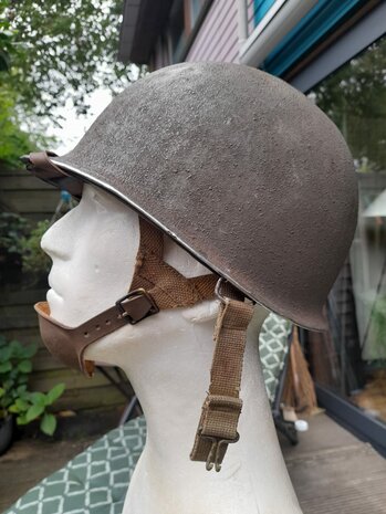 Detail of leather A-yoke, buckle and swivel bail fitting on the WWII M1 Airborne helmet