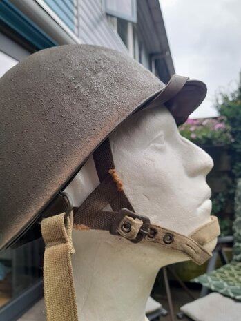 Side detail of the original WWII M1 Airborne helmet with chinstrap configuration
