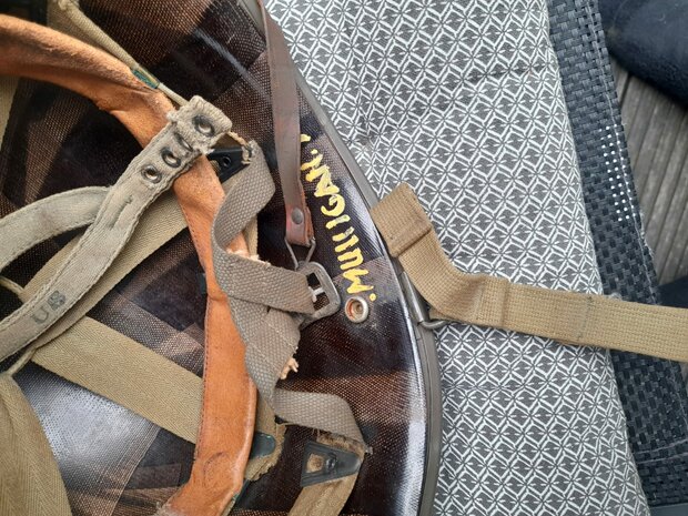 Detail of the name Mulligan inside the liner of the original US M1 helmet